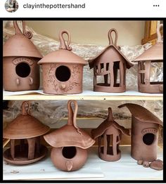 several clay bird houses are on display for sale