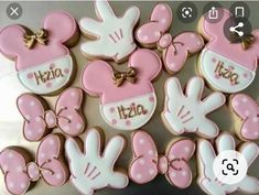 minnie mouse cookies are arranged in the shape of hearts and hands with name on them