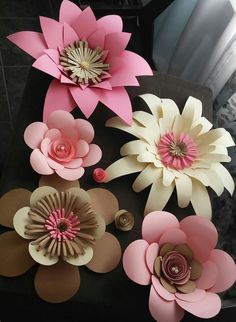 some paper flowers are sitting on a table