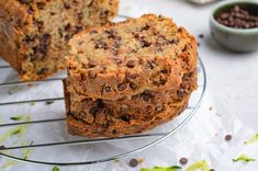 a loaf of chocolate chip banana bread on a cooling rack