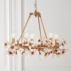 Inspired by the beauty of nature, this whimsical chandelier's glass flowers bloom from the antique gold frame, bringing whimsical style and light to your little one's room. DETAILS THAT MATTER Cast from iron with glass flowers and leaves, and hand finished in antique gold paint. Chandelier features 30 flowers and 30 leaves. Flowers are finished in pink color and leaves are clear glass. Ceiling plate is finished in water-based antique Gold. Clear cord adjusts to your preferred height. Compatible Lampshades Ideas, Grace Flower, Fairytale Room, Nursery Chandelier, Art Geisha, Interactive Lighting, Bedroom Chandelier, Petal Dust, Flower Chandelier