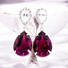 Elegant and Romantic  Amethyst Teardrop Dangle Earrings! Amethyst is the February Birthstone. Earrings made with: - 18x13mm genuine Amethyst  teardrop pear shaped fancy stones, set in sterling silver plated settings - Hypoallergenic, Rhodium plated and tarnish resistant .925 Sterling Silver pear shaped ear posts with AAA cubic zirconia stones  - these are approx 1 1/4" from top of the ear posts to bottom of the stones These dazzling fancy crystals are designed with incredible facets that produce Plum Purple Wedding, Purple Wedding Jewelry, Bridesmaids Earrings, Crystal Bridal Earrings, Fancy Stones, Teardrop Dangle Earrings, Birthstone Earrings, February Birthstone, Plum Purple