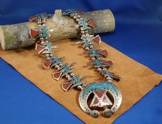 Vintage Native American, circa 970's, Stamped with a Bear Foot Image, Thunderbird motif. Silver Percentage Content is likely Sterling.  228.5 grams  2 3/4"h x  2 1/2"w Naja dimensions  2"w x 1"h each bird's dimensions 34 1/2" length  Southwest Collector's Gift, Sister Jewelry Gift, Daughter Jewelry Gift, Step-mom Jewelry Gift,  Girlfriend Jewelry Gift  All our pieces are Environmentally Sustainable. FREE USPS Priority Mail Shipping arrives in 2-3 business days +1 business day processing time. Up Traditional Turquoise Concho Necklace, Traditional Turquoise Necklace With Concho, Southwestern Style Necklaces For Festivals, Southwestern Style Turquoise Necklace For Festivals, Southwestern Turquoise Necklace For Festivals, Girlfriend Jewelry Gift, Mom Gifts Jewelry, Girlfriend Jewelry, Step Mom