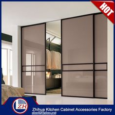 the interior of a bedroom with sliding glass doors and closets in different colors, sizes and styles