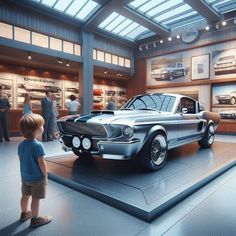 a little boy looking at an old car on display in a museum with people standing around