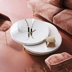 a modern living room with pink velvet couches and gold accents on the coffee table