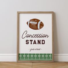 a framed football poster with the words, concession stand grab a seat