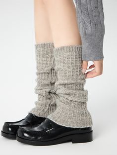 Embrace the chill of autumn and winter with these delightful leg warmers, available in classic shades of white, black, and gray. Crafted from a soft, cozy knit, these leg warmers are designed to keep you warm and stylish all season long. Soft Solid Winter Socks, Winter Soft Solid Color Socks, Cozy Knee-high Winter Socks, Knee-high Cable Knit Winter Socks, One Size Knee-high Socks For Fall, Comfortable Mid-calf Socks For Fall, Winter Acrylic Socks, Warm Fitted Cozy Socks, Warm Cozy Fitted Socks