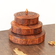 three wooden containers sitting on top of a table