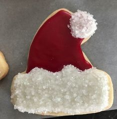 a cookie decorated like santa claus with sugar on it