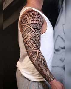 a man with a tattoo on his arm