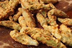 some fried food sitting on top of a wooden table