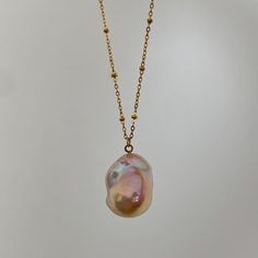 🌈Colorful Baroque Pearl Necklace 🌈 This Baroque Pearl Pendant Necklace features a handpicked, one-of-a-kind natural baroque pearl with a colorful orange-pink lustre, suspended from a waterproof stainless steel chain. *This is a handpicked, one-of-a-kind baroque pearl pendant, you will receive the exact necklace in the picture. :) * MATERIALS: Natural Baroque Pearl, Stainless Steel FINISHING: 18K Gold-Plated LENGTH: Around 48-49cm (non-adjustable) PENDANT DIMENSION: Approx. 22x17mm *Natural mat Multicolor Jewelry With Pearl Charm As Gift, Multicolor Jewelry With Pearl Charm For Gift, Multicolor Pearl Charm Jewelry As Gift, Multicolor Pearl Charm Jewelry Gift, Multicolor Necklaces With Pearl Charm As Gift, Multicolor Pearl Charm Necklace For Gifts, Handmade Pink Drop Necklaces, Multicolor Pearl Drop Jewelry As Gift, Multicolor Pearl Chain Jewelry For Gift