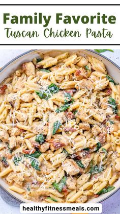 a pasta dish with chicken and spinach in a pan