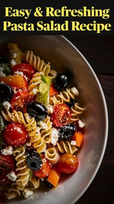 a white bowl filled with pasta and olives