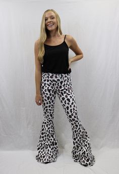 These leopard flared denim pants are sure to be a show stopping staple piece. Pair with our black ribbed tank for a stand out outfit!! Model is wearing a size small. Edgy Flare Bottoms For Fall, Black Wide Leg Flares For Spring, Casual Black Flares For Night Out, Casual Flare Jeans For Night Out, Casual Flares For Night Out In Spring, Casual Wide Leg Flares For Night Out, Summer High Waist Black Flare Jeans, Black High Waist Flare Jeans For Summer, High Waist Black Flare Jeans For Summer