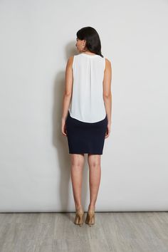 Luxurious Georgette elevates this minimalist top. Its split neckline and soft shoulder pleat detail add a touch of feminine flair. This essential piece will take you from Spring into Fall. T-Tahari Sleeveless Split Neck Georgette Shirt Relaxed Fit; Runs true to size. Model is 5'9" and wearing size S Imported Style #: THF41048 Sleeveless Blouse For Business Casual, Sleeveless Business Casual Blouse, Versatile Sleeveless Top For Business Casual, Sleek Sleeveless Blouse For Work, Versatile Sleeveless Viscose Blouse, Viscose Sleeveless Blouse Tank Top For Work, Sleeveless Viscose Tank Top For Work, Flattering Sleeveless Tops, Elegant Sleeveless Tops For Business Casual