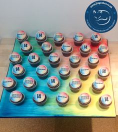 cupcakes are arranged in the shape of a number on top of a table