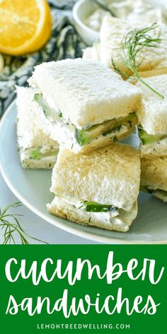 cucumber sandwiches stacked on top of each other with lemons in the background