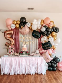 a birthday party with balloons and decorations