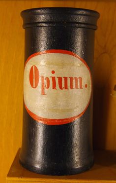 an open can sitting on top of a wooden shelf