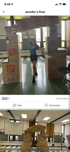 a woman standing next to boxes in an empty room