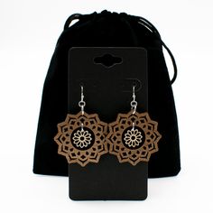 "An intricately cut flower dangles in the center of a mandala to create these boho style earrings. Two tones of wood - walnut and maple - add interest and ensure these earrings will be visible against any hair color. Laser cut wood earrings can be dressed up or down, making them the perfect complement to any outfit! These earrings are strong but so lightweight and comfortable, you will hardly know you have them on! Pair with the matching mandala and flower necklace for a coordinated look: https: Bohemian Brown Earrings As Gift, Bohemian Brown Earrings For Gift, Bohemian Brown Flower Jewelry, Brown Drop Flower Earrings For Gift, Brown Flower Drop Earrings For Gift, Brown Flower-shaped Jewelry Gift, Brown Flower Shaped Earrings For Gift, Brown Flower-shaped Earrings For Gift, Elegant Brown Drop Flower Earrings