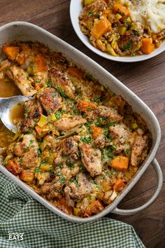 a casserole dish with chicken, vegetables and mashed potatoes on the side