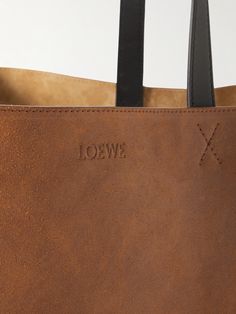 Crafted from panels of suede, Loewe's 'Puzzle' tote bag has been hand-brushed to achieve a faded look. The geometric creases allow it to be folded flat, making it an easy addition to your suitcase. It has leather top handles and can comfortably carry a book, tablet and sweater. Porter Bag, Loewe Puzzle, Tom Ford Bag, Suede Tote Bag, Large Leather Tote Bag, Loewe Bag, Craft Tote Bag, Suede Tote, Latest Bags