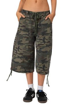 Channel laid-back skater style with these baggy cotton-twill Bermuda shorts in a camo pattern. Drawstrings cinch the waist and hems for next-level coolness. Zip fly with button closure Drawstring waist Front slant pockets; back flap-patch pocket; cargo flap-patch pocket Drawstring hems 100% cotton Machine wash, line dry Imported Cargo Bermuda Shorts, Bermuda Shorts Women, Swimsuit Cover Up Dress, Concert Fits, Skater Style, Sports Blazer, Designer Clothes For Men, Casual Coat, Casual Socks