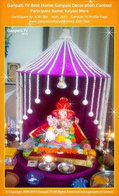 the ganpati is decorated with beads and lights