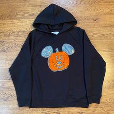 Brand New Disney Halloween Hoodie With Sparkle “Mickey Mouse” Pumpkin. Bundle With Other Disney Halloween Items On My Page! See Last Picture For Ultimate Bundle Ideas! Bundle Items Sold Separately! Limited Sizes And Quantities While Supplies Last. Disney Halloween Pumpkin, Mouse Pumpkin, Mickey Mouse Pumpkin, Pumpkin Sweatshirt, Pumpkin Sweatshirts, Halloween Hoodie, Halloween Items, Disney Tops, Disney Halloween