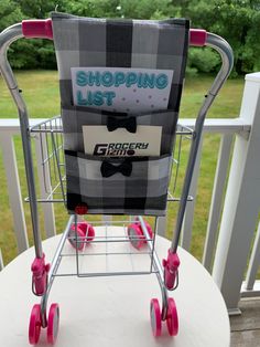 a shopping cart sitting on top of a white table