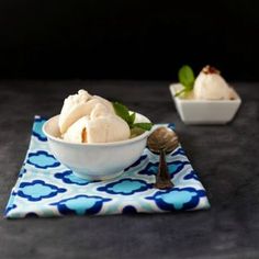 two bowls filled with ice cream on top of a blue and white napkin