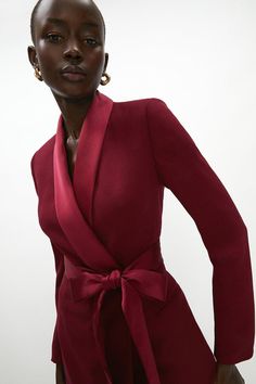 Since first introduced in the 70's, the tuxedo dress is a sign of power and unapologetic confidence for women. Reimagined in a wrap silhouette, with structured shoulders and classic satin trims. Made from satin back crepe: cut from a luxuriously smooth crepe with a subtle sheen to the back, this fabric drapes softly over your silhouette for a figure skimming finish. Level of stretch: little. Model is 5ft 7in/1.75m and wears a size UK10. Confidence For Women, Tuxedo Tie, Modern Mother Of The Bride, Bride Collection, Red Tuxedo, Classic Tailoring, Tuxedo Dress, In The Spotlight, Red Midi Dress