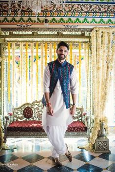 a man standing in front of a decorated stage