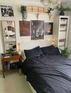 a bed sitting in a bedroom under a chandelier