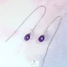 These minimalist elegant purple Amethyst teardrop ear threaders feature a beautiful faceted teardrop shape Amethyst natural stone on 925 sterling silver box chain threaders. Add these elegant purple teardrop Amethyst ear threader earrings to your everyday fine jewelry collection or as a gift for your loved one. Amethyst is a protective stone, it relieves physical and psychological pain or stress. Amethyst is one of the most spiritual stones, encouraging selflessness and spiritual wisdom. Amethyst is February birthstone, these Amethyst teardrop earrings are perfect for February born's people gift. Materials: 925 sterling silver, natural Amethyst Jewelry Care: See more information about how to care for your jewelry here. Shipping Policy: Orders will be shipped within 1-3 business days. Econo Elegant Sterling Silver Teardrop Threader Earrings, Nickel-free Sterling Silver Teardrop Threader Earrings, Nickel-free Teardrop Threader Earrings For Gifts, Dainty Handmade Teardrop Threader Earrings, Dainty Drop Threader Earrings For Gift, Dainty Drop Threader Earrings As Gift, Delicate Adjustable Sterling Silver Threader Earrings, Silver Drop Threader Earrings For Gift, Minimalist Teardrop Threader Earrings With Adjustable Chain