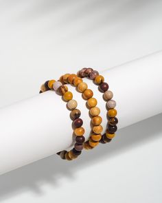 Enjoy this set of three gorgeous Mala bracelets for yourself or as a gift! Mookaite has the ability to enrich your trust and love for Mother Earth and all of her beauty. You can find beautiful awareness of your natural surroundings and ground yourself in connection. Bracelet set includes: Mookaite Mala Mookaite & Palo Santo diffuser Mala Palo Santo diffuser Mala Your purchase directly supports mental health awareness and organizations; thank you. Gift Brown Stackable Beaded Bracelets, Gift Stackable Brown Beaded Bracelets, Spiritual Brown Stackable Beaded Bracelets, Brown Stackable Beaded Bracelets Gift, Brown Jasper Beaded Bracelets Gift, Brown Jasper Bracelets With Round Beads, Brown Jasper Bracelets With Natural Stones, Spiritual Jasper Bracelets With 8mm Beads, Brown Natural Stones Bracelet For Meditation