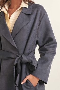 Faux suede trench coat. Oversized notch lapel collar. Open front. Removeable tie belt. Side pockets. Long sleeves. Drop shoulder. Knee length. Relaxed fit. 92% Polyester, 8% Spandex. This item is final sale. Suede Trench Coat, Mood Indigo, Foreign Affairs, Suede Belt, Belted Trench Coat, Belt Tying, Lapel Collar, Tie Belt, Front Open