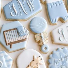 baby shower cookies are arranged on a table