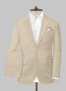 A sophisticated suit even when the heat is trying its very best to have the opposite effect. Crafted from cotton lycra, the beige hue of the Italian Sand Beige Cotton Stretch Suit can do wonders while the lightness of the material will make it an ideal choice when the temperature rises.   Look Includes  Italian Sand Beige Cotton Stretch Fabric  Two Button Jacket Style  Notch Lapel  Corozo Beige Buttons  Single Vent  Three Cuff Buttons  Two Welted Back Pockets on Trousers   You can change the look during customization if required.   Lining: Viscose; Dry Clean. Luxury Beige Suits For Spring, Elegant Cotton Suits For Business Casual, Fitted Beige Cotton Suits, Elegant Long Sleeve Cotton Suits, Tailored Beige Cotton Suit, Classic Beige Cotton Suit, Beige Summer Formal Suit, Summer Beige Formal Suit, Beige Cotton Suits For Workwear