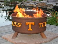 a fire pit sitting on top of a wooden platform