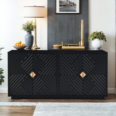 a black and gold sideboard in a living room