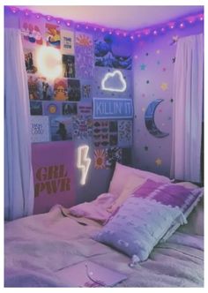 a bedroom with pink and purple lights on the ceiling