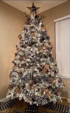 a decorated christmas tree with black and white ornaments