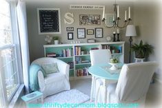 a dining room filled with furniture and a book shelf next to a large open window