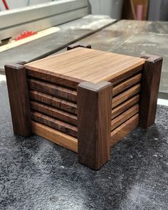 a wooden object sitting on top of a table