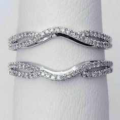 two white gold wedding bands with diamonds on each band, set in 18k white gold