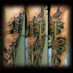 a man's arm with some tattoos on it and an image of a machine in the background